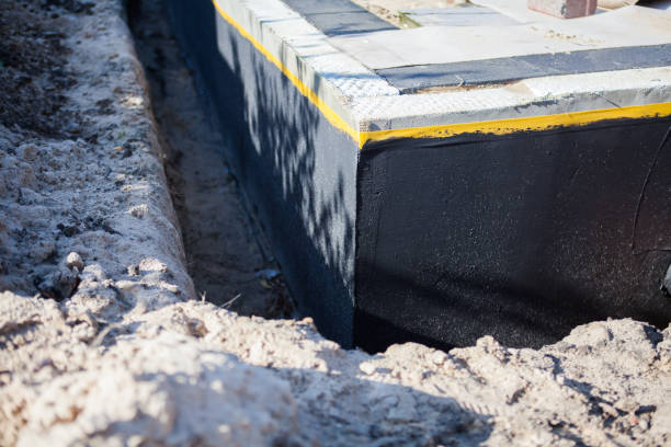 Professional Waterproofing technician working in Belleville, IL